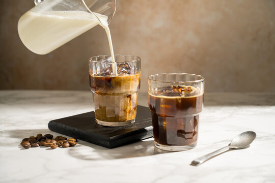 Glass with iced latte, refreshing energy coffee drinks