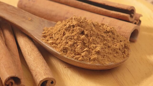 Cinnamon powder on a spoon.