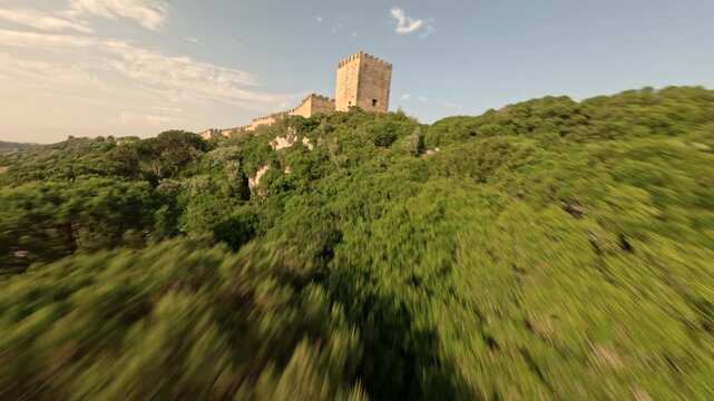 FPV drone flying close to castle walls in &Oacute;bidos Portugal with elevated view of medieval village and depth perspective.
4K high quality immersive cinematic FPV footage.