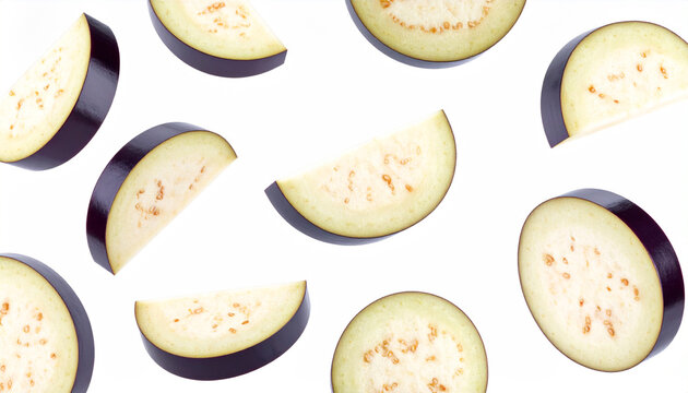 Assortment of fresh eggplant slices in various orientations on a white backdrop