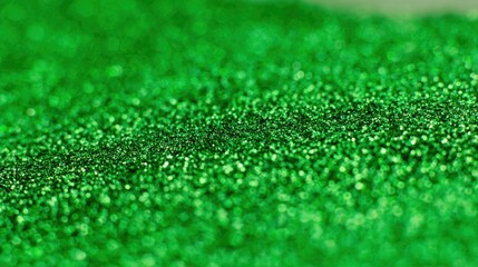 Fototapeta premium Close-up of sparkly, shimmering green material, possibly glitter or a textured surface