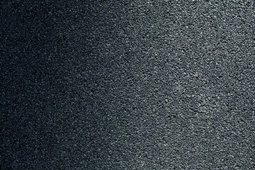 Fototapeta premium background texture of dark gray asphalt, top view