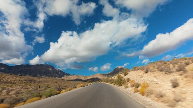 Red Rock Canyon Scenic Drive Loop POV 4K Sunny Day Dramatic Clouds Nevada