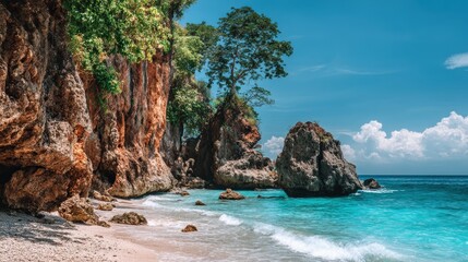 Obraz premium Tropical beach landscape features limestone cliffs and turquoise water under a clear blue sky.