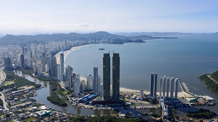 High aerial view of Barra Sul with twin towers, Camboriu River, marina and city bay, Balneario Camboriu, Santa Catarina. © Marcio Eneas