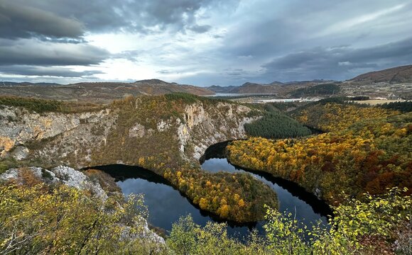 Meandering river with autumn forest and dramatic sky, Uvac River, Serbia