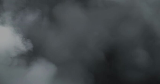 Smoke on black background. Premium cinematic fog and smoke VFX element featuring smooth, continuous motion and carefully balanced density that creates a believable and engaging atmospheric effect.