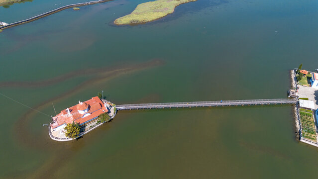 Aerial view of the Monastery of Agios Nikolaos on Vistonida Lake with wooden bridges, Xanthi, Greece.