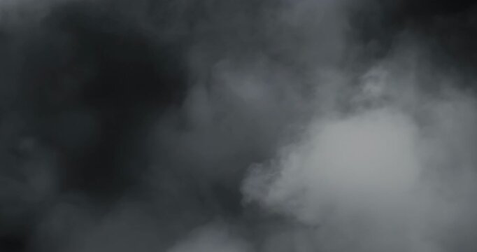 Smoke on black background. Premium cinematic fog and smoke VFX element featuring smooth, continuous motion and carefully balanced density that creates a believable and engaging atmospheric effect.