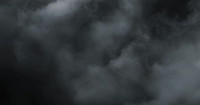 Smoke on black background. Premium cinematic fog and smoke VFX element featuring smooth, continuous motion and carefully balanced density that creates a believable and engaging atmospheric effect.