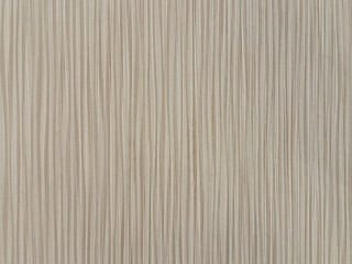 Obraz premium Close up of wallpaper in random vertical lines stripes, in light beige or gray color. Suitable for wall covering, upholstery. Seamless background texture.