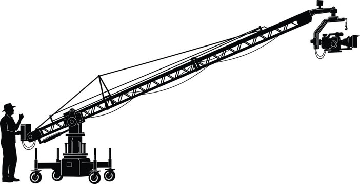 Silhouette of professional cameraman operating large camera crane jib on film set for cinema production television broadcasting and movie making industry