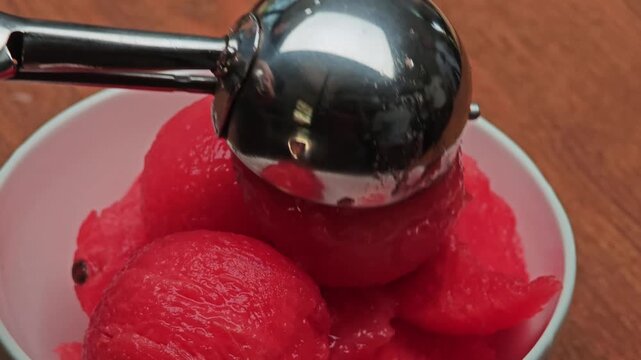 Watermelon fruit served with a scoop.