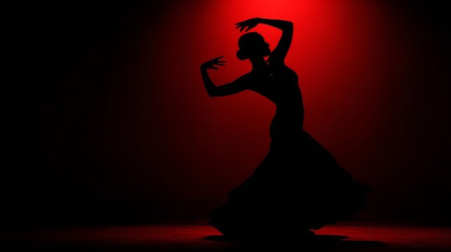 Elegant silhouette of a flamenco dancer in a dramatic red spotlight