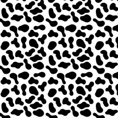 Obraz premium Seamless black and white cow spots pattern.