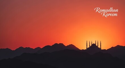 Ramadan Kareem mosque silhouette against a vibrant sunset sky.