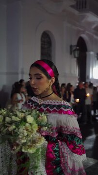 Holy Week in Popay&aacute;n, Colombia &ndash; Female &ldquo;Sahumadora&rdquo; Accompanying Religious Floats (Pasos), Spreading Incense Through Historic Streets Surrounded by Devout Candle Bearers and Tourists
