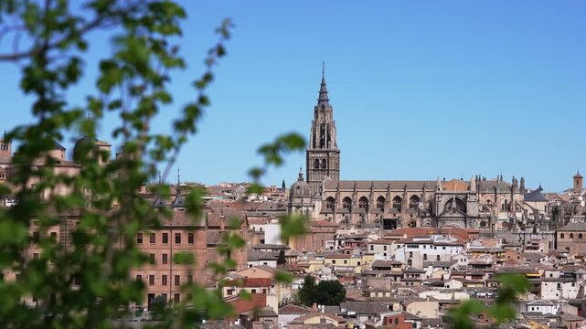 Scenic panorama of the historic city of Toledo with its famous cathedral under a clear blue sky. A beautiful European travel destination