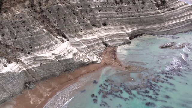 Scala dei Turchi, or the Turkish stairs in Sicily, Italy. Aerial Drone Shot. Unique White Rocks and Turquoise water.