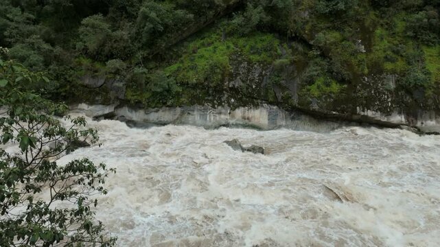 View of rushing river from a window in Aguas Calientes Peru
