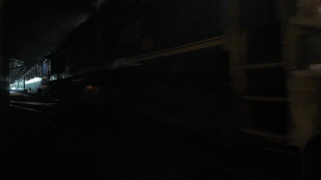 Train departing Aguas Calientes at night in Peru