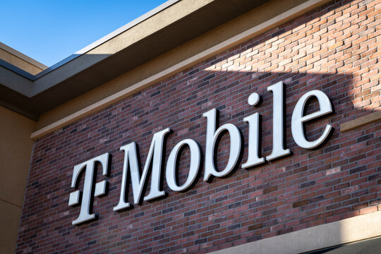 Fort Collins, CO, USA - March 18, 2023: T-Mobile sign on a buiding facade - America's largest 5G network.