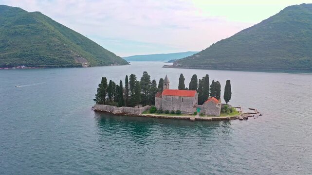 Aerial view of St. George Island surrounded by sea. Tourist attraction of the ancient monastery on the island near Perast, in the Bay of Kotor, Montenegro