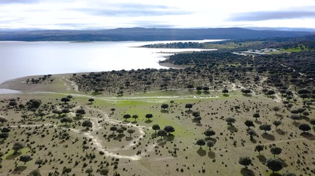 Aerial view of Santa Teresa Reservoir in Salamanca, Spain. Large freshwater reservoir on the Tormes River surrounded by agricultural plains and rolling hills, strategic water resource in Castilla y Le