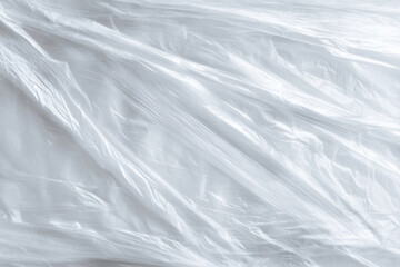 Obraz premium Plastic wrap covers a flat surface in a simple kitchen setting during daylight hours