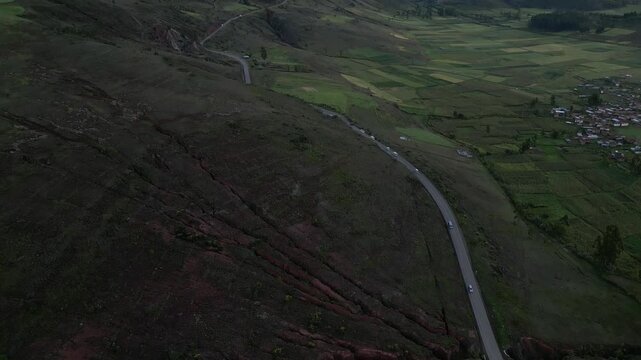 Drone perspective following a road winding through a Peruvian valley