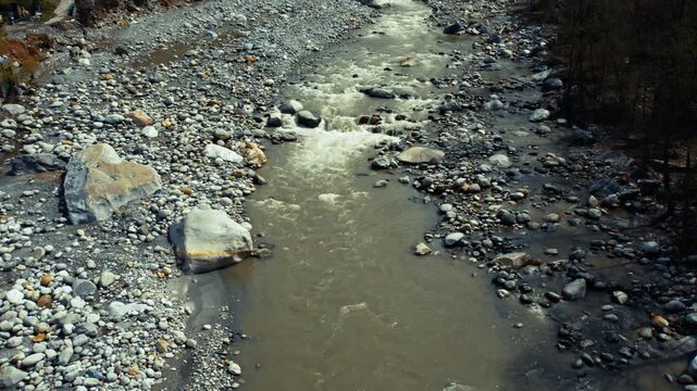Mountain river flowing through rocky terrain, showing natural landscape, outdoor environment and scenic background for travel and commercial use
