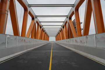 diminishing perspective view of bicycle bridge in the city