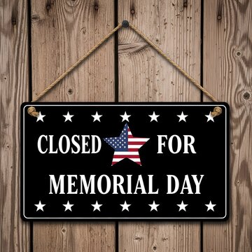 Closed for memorial day sign displayed in a modern office building