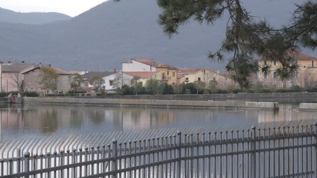 Water reservoir in the historic village of Rocchetta a Volturno, Molise, Italy, with mountain background.
