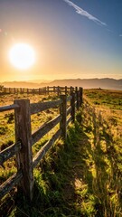 Obraz premium Serene Sunrise Overrolling Hills with Rustic Wooden Fence