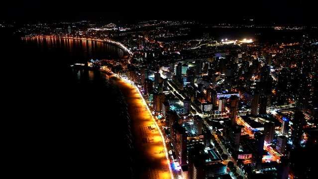 Aerial nocturne view of the skyscrapers of Levante Beach and city center in the Mediterranean city of Benidorm, Spain. 