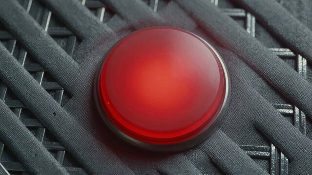 Bright red button on black fabric