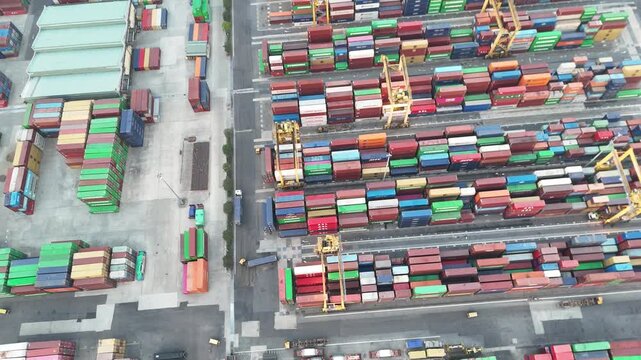 Aerial Top Down View of Container Terminal with Shipping Containers and Cranes
