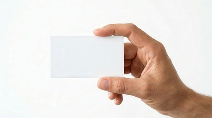 Obraz premium Realistic Photo of Hand Holding Blank Business Card for Marketing and Networking
