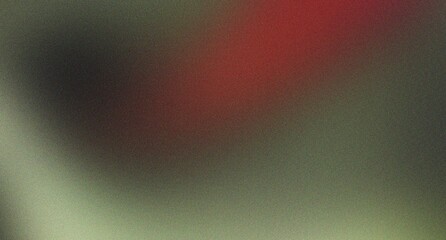 Fototapeta premium Blurred abstract background with subtle green and red tones and grainy texture, creating an ethereal and artistic visual for creative use.
