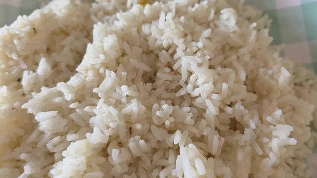 Steaming white rice pile, close-up macro shot, healthy staple food background, cooked rice