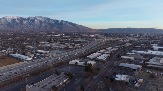 Aerial view of I-15 highway and city of Midvale Utah at dusk