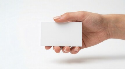 Obraz premium Photorealistic Hand Holding Blank Business Card for Professional Marketing