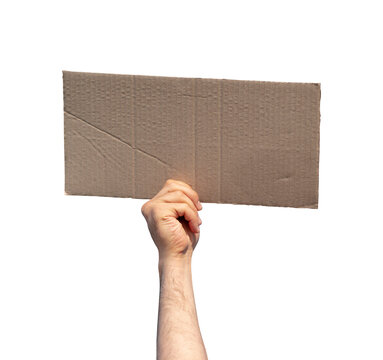 Hand holding blank cardboard protest sign isolated