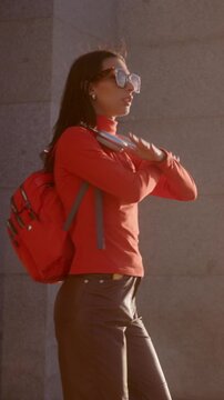 Stylish woman dancing and enjoying a sunny day in Madrid Almudena Cathedral