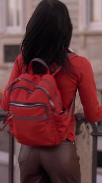 Young female university student walking with hopeful future vision