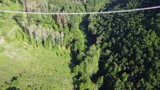 Close Aerial View of Geierlay Suspension Bridge over Deep Gorge, Germany