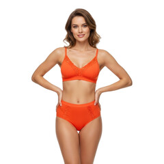 Obraz premium Woman in orange lingerie with hands on hips