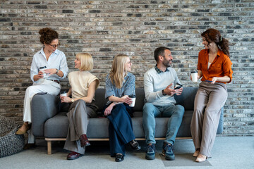 Fototapeta premium Coworkers relaxing and communicating during a break