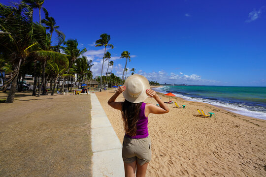 Holidays in Brazil. Happy traveler woman looking at amazing beach in Maceio, Brazil.